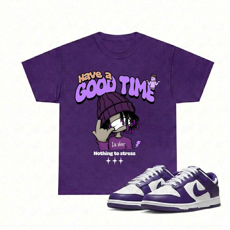 May include: Purple t-shirt with the text "Have a Good Time" and a cartoon graphic of a person wearing a beanie. The shirt is paired with purple and white sneakers.