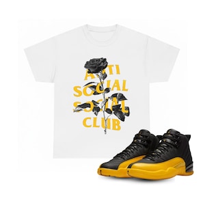 white and gold jordan shirt