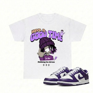 May include: White t-shirt with a purple graphic that says "Have a Good Time" and "Nothing to stress". The graphic features a cartoon character wearing a purple beanie. A pair of purple and white sneakers are in the foreground.