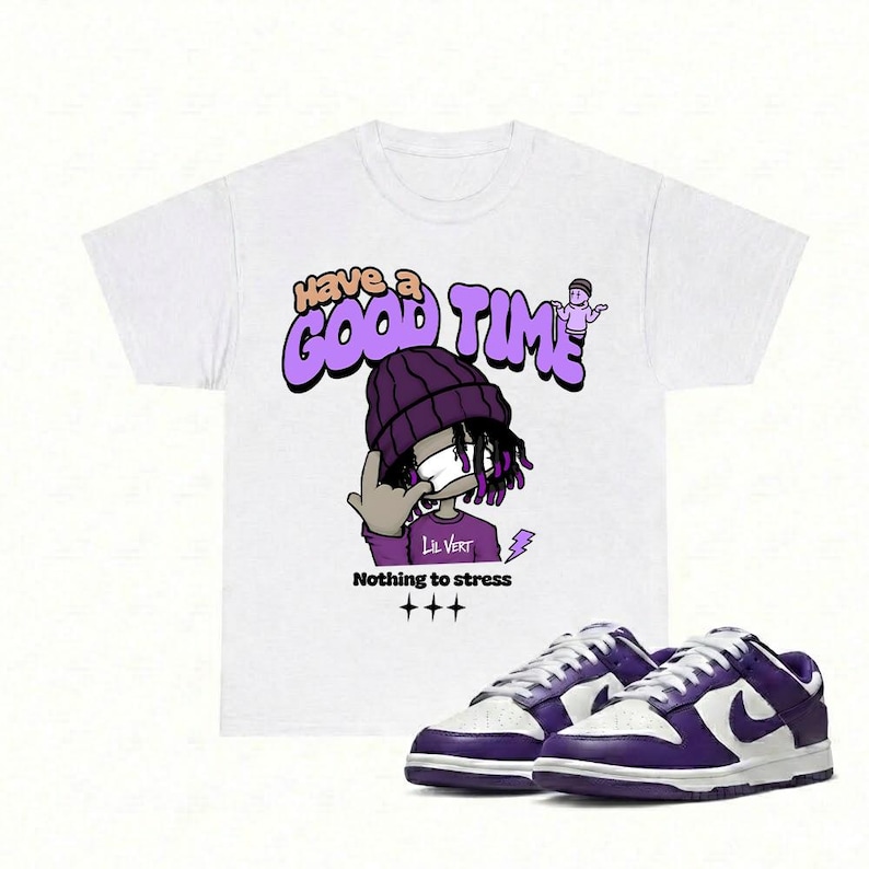 May include: White t-shirt with a purple graphic that says "Have a Good Time" and "Nothing to stress". The graphic features a cartoon character wearing a purple beanie. A pair of purple and white sneakers are in the foreground.