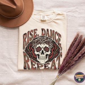 Rise Dance Repeat Skull Shirt | Comfort Colors thorned vine crown lettering, gothic nightclub aesthetic, Halloween season garment dyed tee