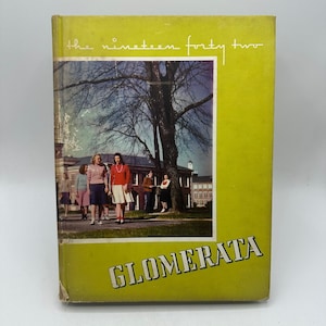 May include: A vintage yearbook titled "The Nineteen Forty Two" with a lime green cover. The cover features a photograph of students on a campus with a large tree. The word "GLOMERATA" is printed in a bold, angled font.