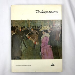 May include: A hardback book titled Toulouse-Lautrec with text by Douglas Cooper. The cover features a reproduction of a painting depicting a crowded dance hall scene with figures in period clothing, including a woman in a pink dress and hat.