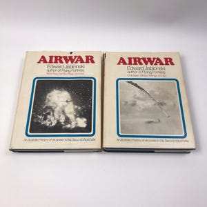 May include: Two vintage books titled "AIRWAR" by Edward Jablonski. The covers feature a white background with a blue border around a black and white image. The text on the covers includes the author's name and the phrase "An illustrated history of air power in the Second World War."
