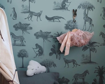 May include: A nursery scene featuring a teal wallpaper with a safari animal print. A pink tutu hangs on a wooden hanger. A cloud-shaped pillow and a gray pillow are on a bed. A white teepee is in the corner.