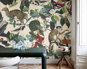 May include: A room featuring a green table and a white chair with black trim. The wall is covered in wallpaper with a botanical design, including monkeys, birds, and leopards amidst lush green foliage and flowers. The floor has a herringbone pattern.