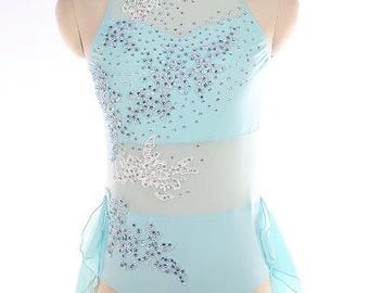 May include: A light blue dance leotard with a halter neckline and a sheer panel across the midriff. The leotard is embellished with silver rhinestones and white floral appliques. A matching skirt is attached at the waist.