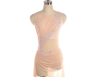 May include: A sleeveless peach-colored dance dress featuring a sheer mesh bodice and a draped skirt. The garment is adorned with an asymmetrical diagonal panel of white floral lace appliques and clear crystals extending from the shoulder to the hip.