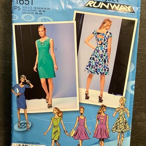 May include: Simplicity 1651 sewing pattern featuring dress designs. The pattern includes sizes 12, 14, 16, 18, and 20. The cover showcases dress illustrations and the Project Runway logo.
