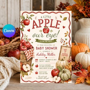 May include: A rectangular baby shower invitation card featuring a cream background with a red scalloped border. The text reads A LITTLE APPLE OF OUR EYE! IS ON THE WAY! PLEASE JOIN US FOR A BABY SHOWER IN HONOR OF ASHLEY MILLER. Includes event details.