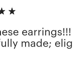 May include: Five star review for earrings. The review reads: "Love these earrings!!! So beautifully made; elegant and lovely!"