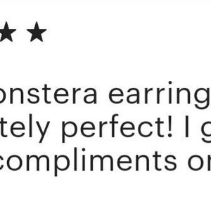 May include: Five star review for Monstera earrings. The review text reads: "The Monstera earrings are absolutely perfect! I get so many compliments on them."