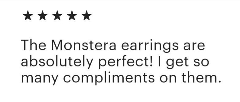 May include: Five star review for Monstera earrings. The review text reads: "The Monstera earrings are absolutely perfect! I get so many compliments on them."
