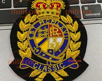 May include: A black embroidered patch with gold, blue, red, and white details. The patch features a crown, laurel leaves, and the word "CLASSIC" in gold lettering. The text "MCMLXV" is also visible.