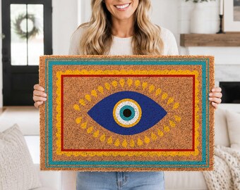 Felpudo bohemio de fibra de coco con diseño de ojo turco, decoración mística para exteriores y protección del hogar.