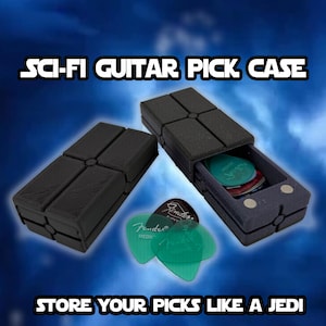 May include: Black sci-fi guitar pick case with a drawer, open to reveal guitar picks. The case is rectangular with a cross design on the top. The text "SCI-FI GUITAR PICK CASE" and "STORE YOUR PICKS LIKE A JEDI" are visible.
