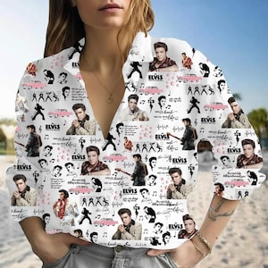 May include: White button-down shirt featuring a collage of Elvis Presley images, pink cars, musical notes, and the word "ELVIS". The shirt has long sleeves and a classic collar, perfect for fans of the iconic singer.