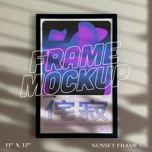May include: Black framed art print with a purple and blue abstract design. The print is labeled "FRAME MOCKUP" and measures 11" x 17". The bottom of the print features Japanese characters and the text "SUNSET FRAME CO."