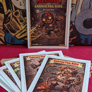 May include: A set of "Webbed Garage Fail Kids" trading cards. The top card features a cartoon character with goggles and a weapon. The cards have a vintage, distressed look. The text "10 Card Set" is visible.