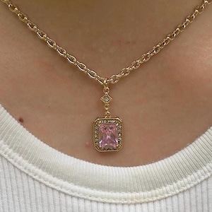 rectangle-cut pink gemstone pendant charm on a gold-plated stainless steel chain necklace