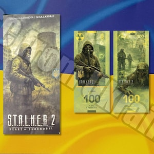 May include: A promotional item featuring a design inspired by the video game "S.T.A.L.K.E.R. 2: Heart of Chornobyl." The image shows a vertical card and three banknotes with a soldier in a gas mask and the number 100.