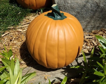 8-3/4 inch tall Pumpkin. 28-1/4 inches around. Hand Painted.