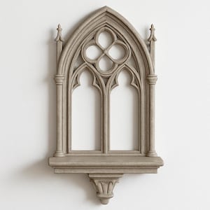 May include: A gray gothic-style wall shelf with an arched top and intricate quatrefoil and pointed arch details. The shelf has two arched openings and decorative finials. The shelf is made of a stone-like material.
