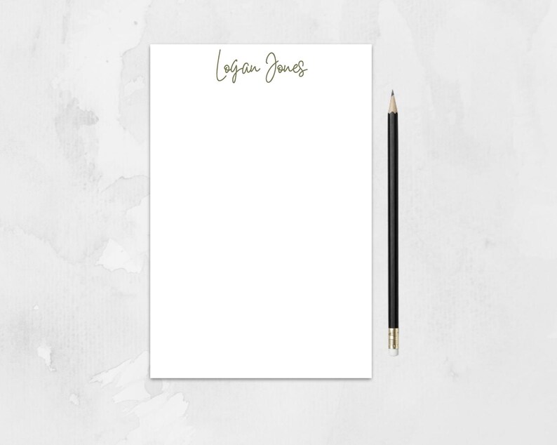 May include: A white notepad with the name "Logan Jones" written in cursive at the top.