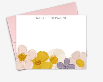 May include: Floral stationery set with a pink envelope and white card featuring the name "Rachel Howard" printed at the top. The card has a border of pink, yellow, and purple flowers.