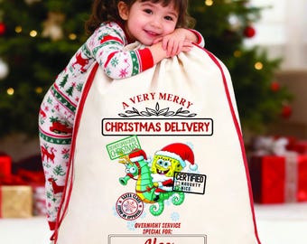スポンジボブのクリスマスサンタサックギフトバッグ、お子様の名前入りサンタサック、北極のプレゼントサック、特別配送サンタサックバッグ
