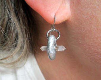 Quartz points double terminated in silver colored clay disk on hypoallergenic earring wires
