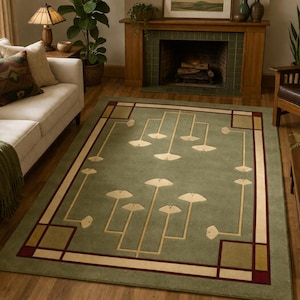 May include: A rectangular area rug featuring a sage green background with a geometric border in cream and dark red. The center displays a symmetrical pattern of stylized cream-colored ginkgo leaf motifs connected by thin, straight lines.
