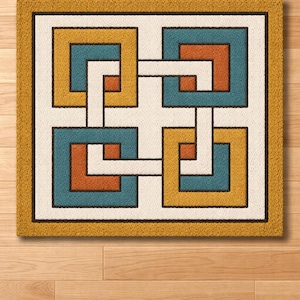 May include: A rectangular doormat with a geometric pattern. It has a mustard yellow border and a cream centre with interlocking squares in teal, orange, and yellow, outlined in black.