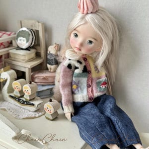 Handmade knitted sweater for Blythe OB24 doll with storybook-inspired patterns