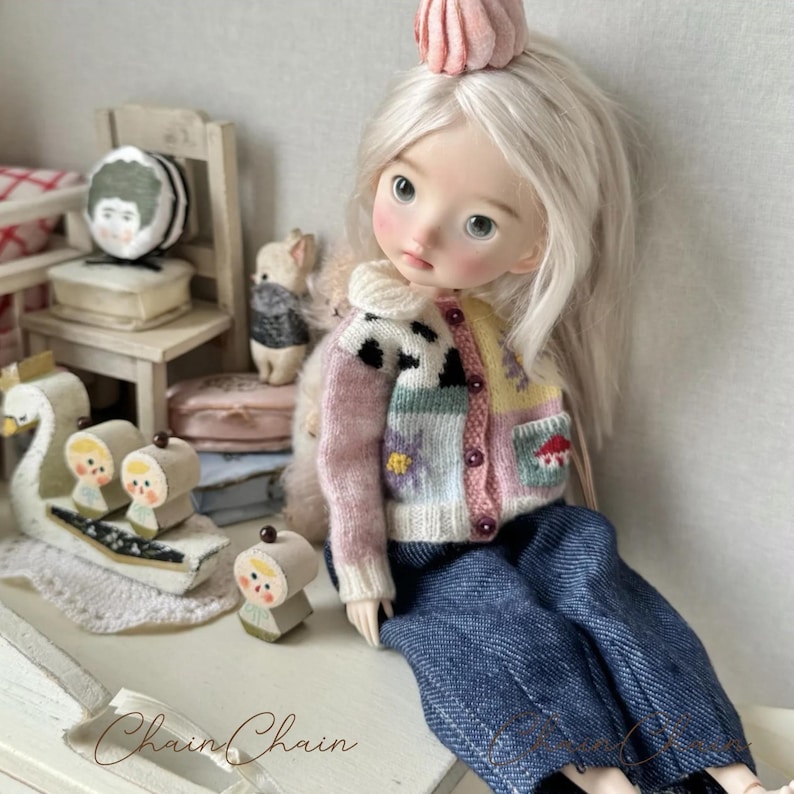 Handmade knitted sweater for Blythe OB24 doll with storybook-inspired patterns
