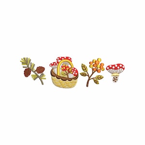 May include: Embroidered design featuring a yellow basket filled with red and white mushrooms and flowers. Other elements include a pine branch with pinecones, a branch with orange berries, and a red and white mushroom. The design is set against a white background.