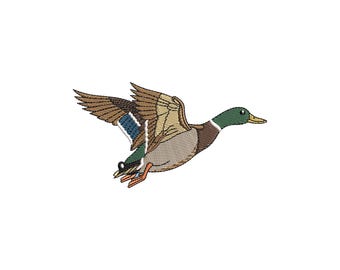 May include: An embroidered patch featuring a mallard duck in flight. The duck has a green head, a yellow beak, brown and tan wings with a blue speculum patch, a light brown chest, and orange feet, all rendered with detailed stitching.