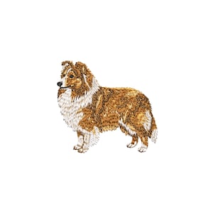 May include: An embroidered patch of a Shetland Sheepdog standing in profile. The dog features a thick coat with shades of sable, tan, and white fur, a pointed snout with a black nose, and upright ears. The design is rendered in detailed thread.