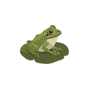 May include: An embroidered design of a green frog with yellow eyes, sitting on a green lily pad. The frog has a detailed pattern on its back and yellow accents on its feet. The design is set against a white background.