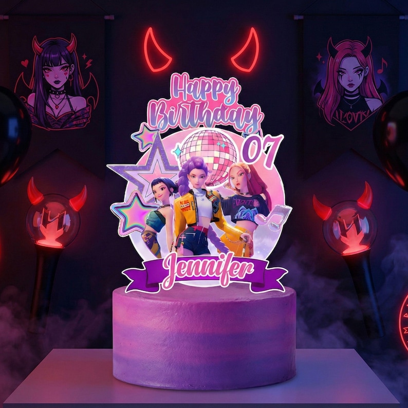 May include: A purple birthday cake with a topper featuring three animated figures, a disco ball, and the text "Happy Birthday 07 Jennifer." The cake is decorated with purple frosting and surrounded by decorative elements.