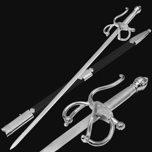 May include: A silver rapier sword with a decorative handle and a black sheath. The sword features a long, slender blade and an ornate guard. The handle has a textured grip and a detailed pommel. The sheath is made of black leather.