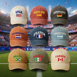 May include: A collection of baseball caps, each featuring a country's name and flag. The caps are in various colors, including white, red, and green. The text "WORLD CUP 2026" is visible in the background.