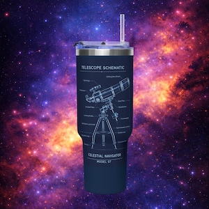 May include: A navy blue tumbler with a schematic diagram of a telescope, labeled "Telescope Schematic." The tumbler also features the text "Celestial Navigator Model 07." It has a silver lid and a clear straw. The background is a colorful galaxy.