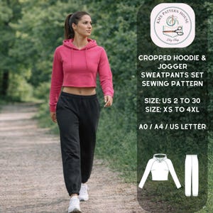 May include: A woman in a pink cropped hoodie and black joggers walks on a path. The image includes text that reads "CROPPED HOODIE & JOGGER SWEATPANTS SET SEWING PATTERN" and size information.