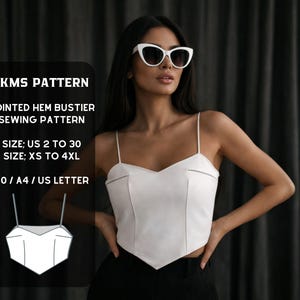 May include: A white pointed hem bustier top with thin straps. The image also includes text that reads "KMS PATTERN", "POINTED HEM BUSTIER SEWING PATTERN", "SIZE: US 2 TO 30", "SIZE: XS TO 4XL", and "AO / A4 / US LETTER". The model is wearing white sunglasses.