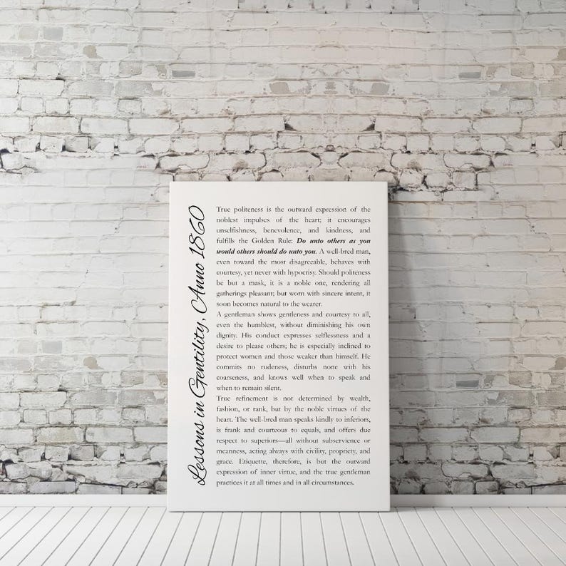 May include: A white canvas print against a brick wall. The print features the text "Lessons in Gentility, Anno 1860" in a script font, along with a lengthy passage about politeness and gentlemanly conduct.