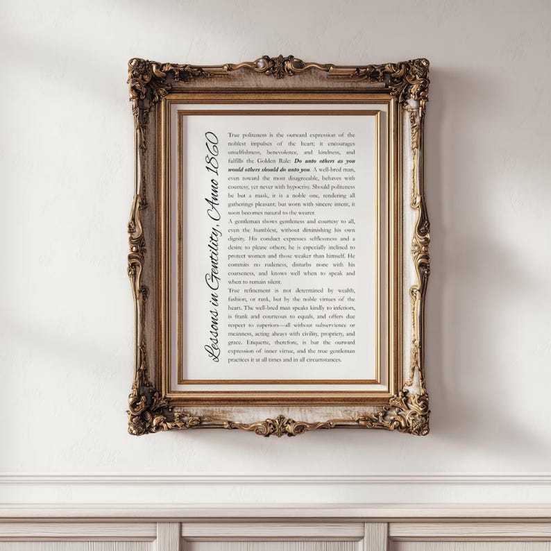 May include: A framed print with ornate gold detailing. The print features text titled "Lessons in Gentility, Anno 1860" in a classic serif font. The frame has a detailed, vintage design, adding to the antique aesthetic.