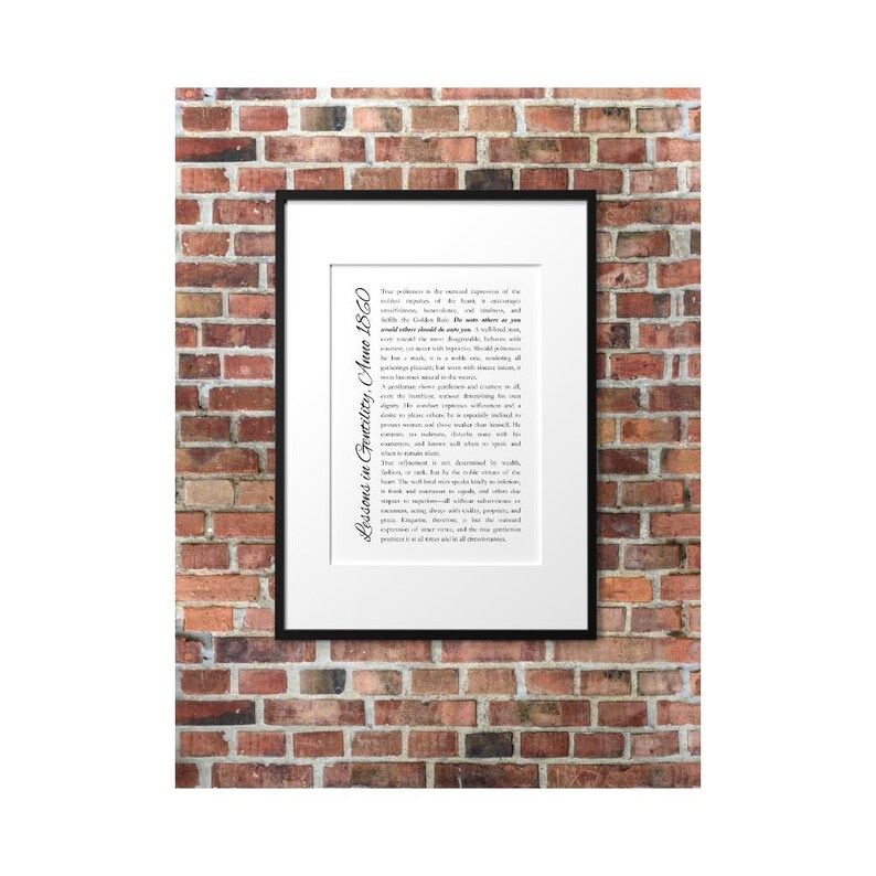 May include: A framed print with a black border, featuring text on a white background. The text is in black and appears to be a historical document. The frame is mounted on a red brick wall. The text on the left side of the frame reads "Lessons in Gentility, Anno 1860."