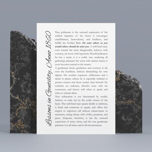 May include: A white card with text, "Lessons in Gentility, Anno 1860," is propped up by two dark, textured stone blocks. The text describes the virtues of politeness and gentlemanly conduct. The card is centered, with the stone blocks on either side.