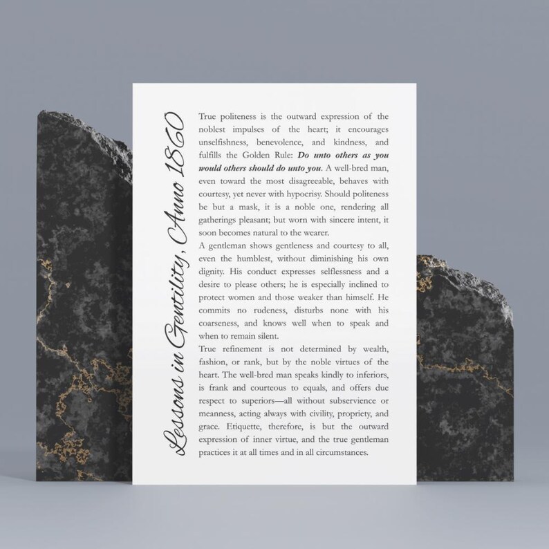 May include: A white card with text, "Lessons in Gentility, Anno 1860," is propped up by two dark, textured stone blocks. The text describes the virtues of politeness and gentlemanly conduct. The card is centered, with the stone blocks on either side.